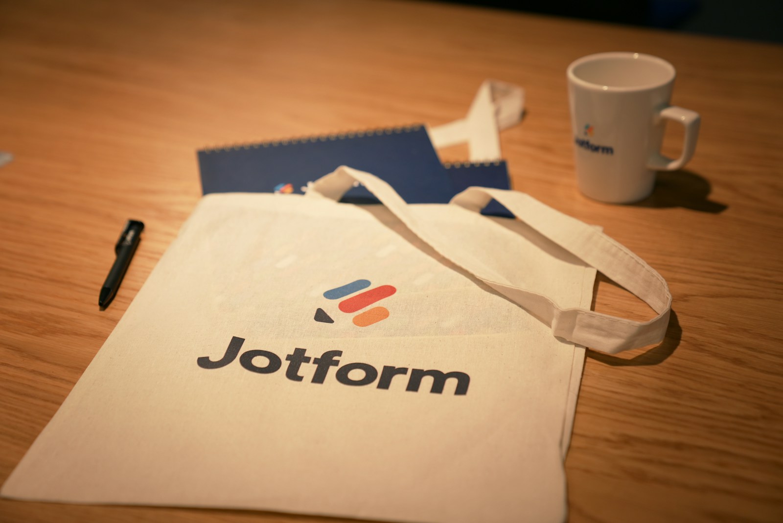 a white bag sitting on top of a wooden table